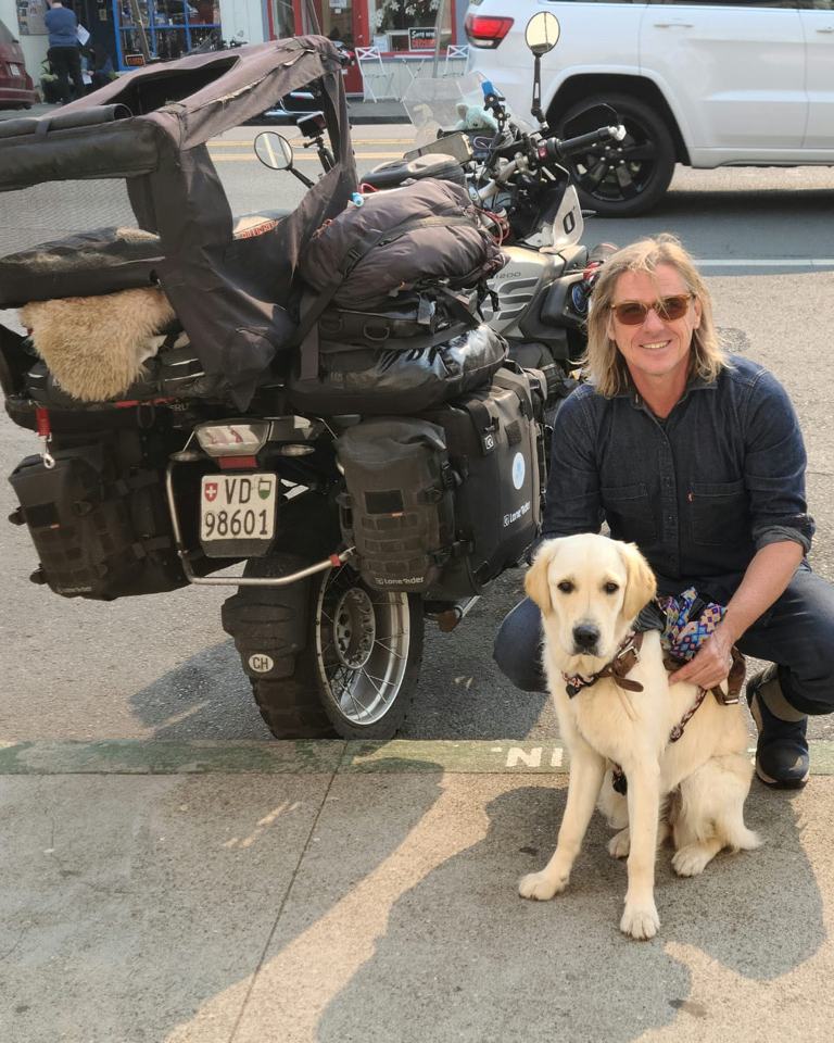 Arnaud and Billie Blue beside the loaded bike, Fort Bragg, California